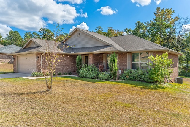 view of front of home featuring a garage and a front lawn