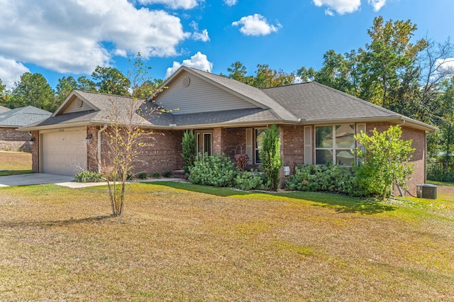 ranch-style house with brick siding, an attached garage, and a front yard