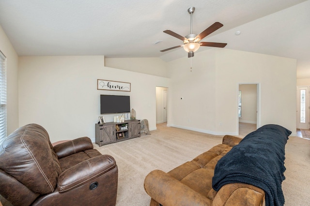 living area featuring ceiling fan, light carpet, baseboards, lofted ceiling, and visible vents