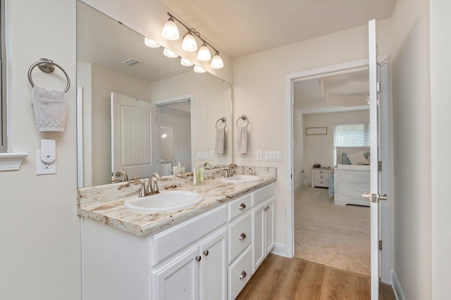 bathroom with vanity and hardwood / wood-style flooring