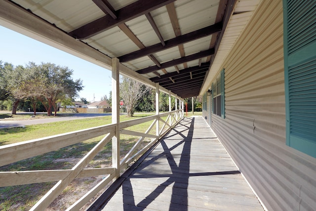 wooden deck with a yard