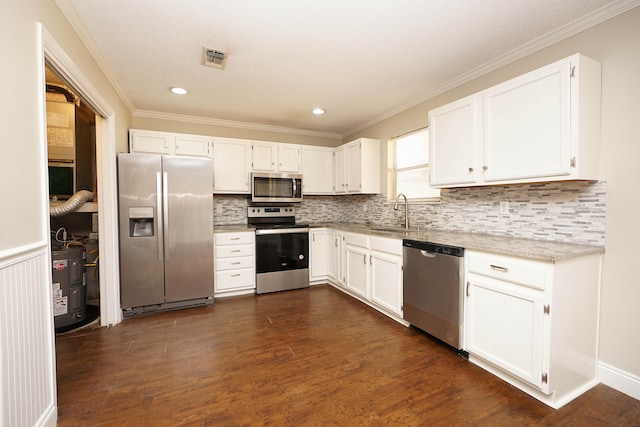 kitchen featuring crown molding, sink, appliances with stainless steel finishes, dark hardwood / wood-style flooring, and white cabinetry