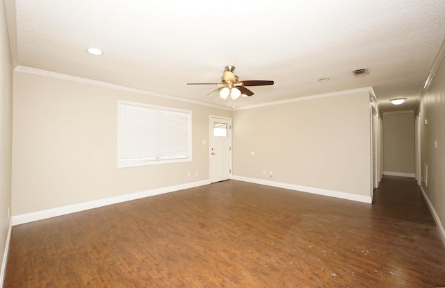 spare room with crown molding and dark hardwood / wood-style floors