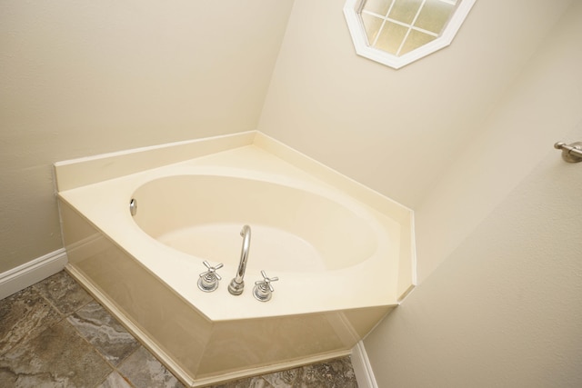 bathroom featuring a tub to relax in