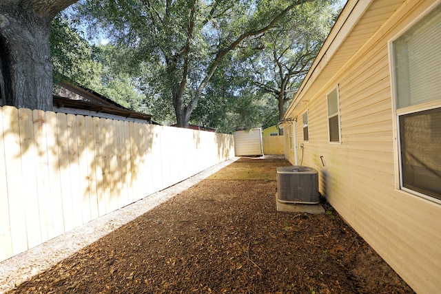 view of yard with central AC