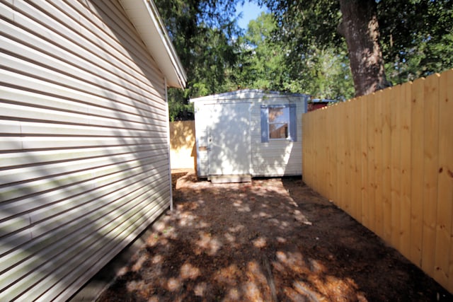 view of property exterior with a shed