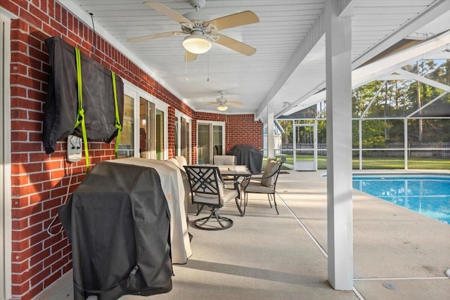 exterior space with ceiling fan, a lanai, and grilling area