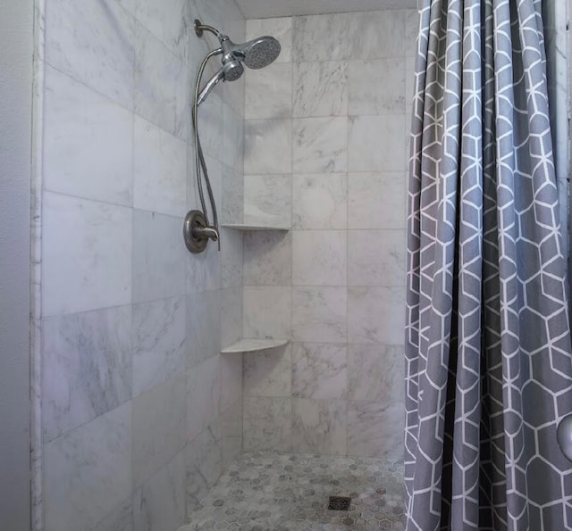 bathroom featuring a shower with curtain