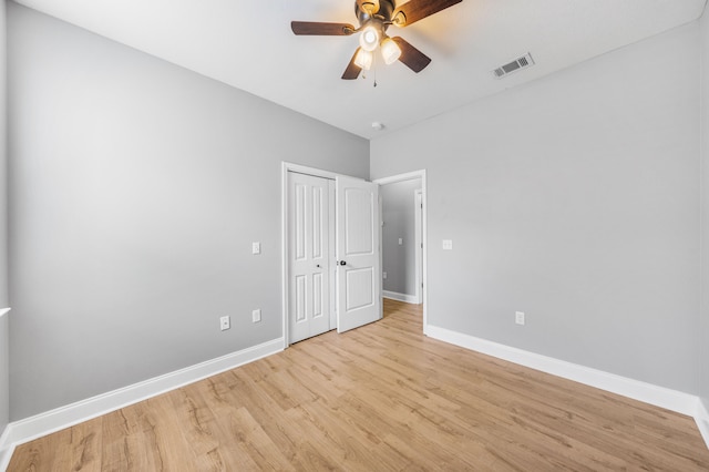 empty room featuring ceiling fan and light hardwood / wood-style flooring