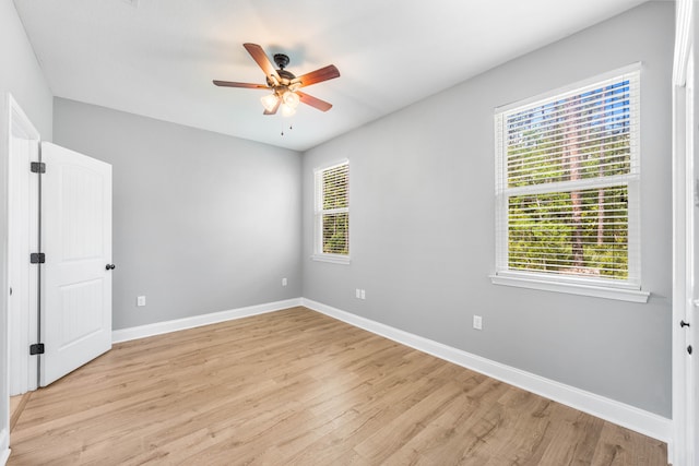 empty room featuring light hardwood / wood-style floors and ceiling fan