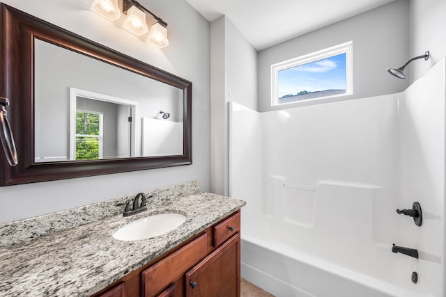 bathroom with vanity and tub / shower combination