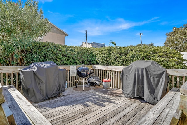 wooden terrace featuring grilling area