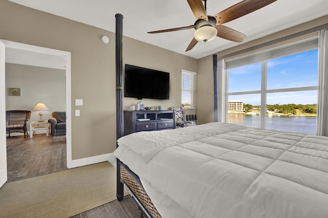 bedroom with hardwood / wood-style floors and ceiling fan