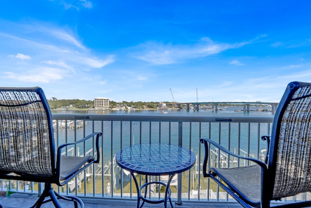 balcony featuring a water view