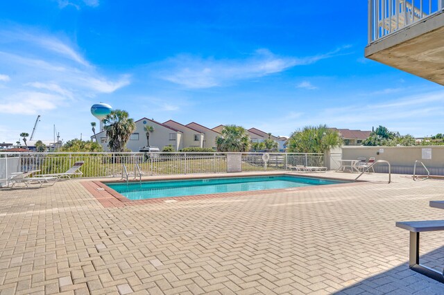 view of swimming pool featuring a patio