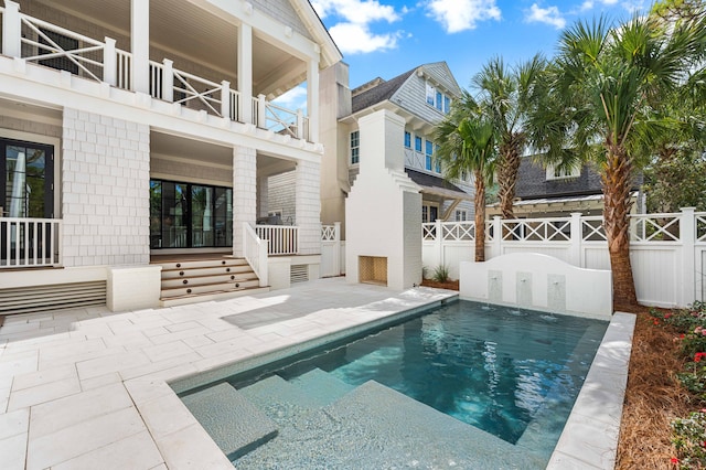 view of swimming pool featuring a patio