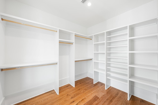 spacious closet featuring light wood finished floors and visible vents