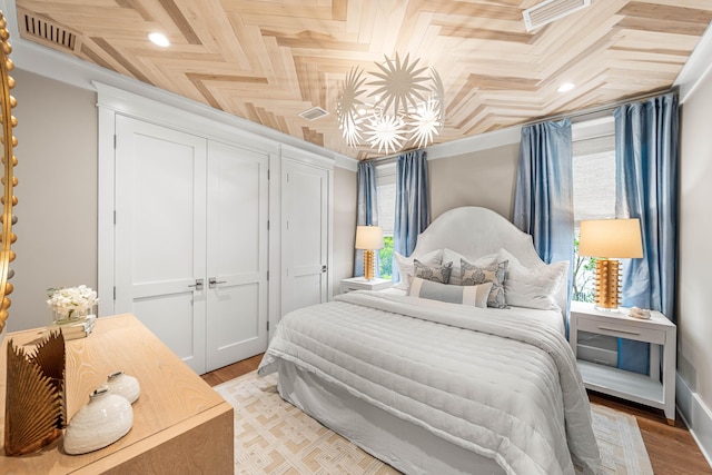 bedroom with light wood-style floors and a closet