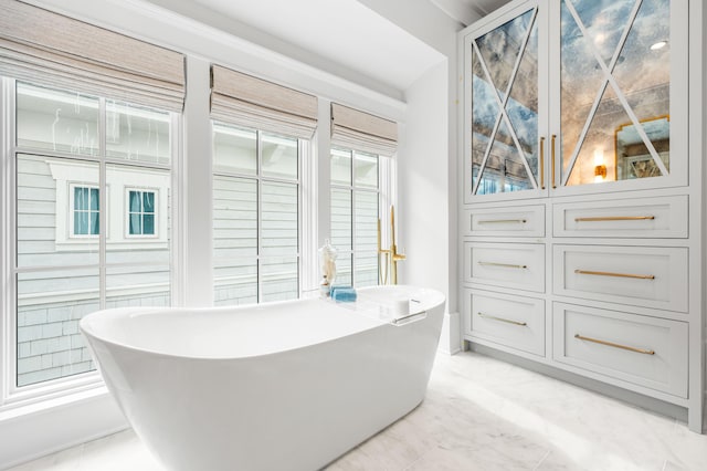 full bath featuring a freestanding tub