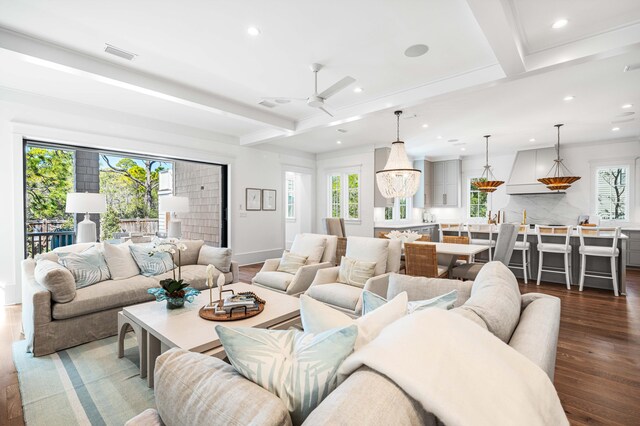 living area with a ceiling fan, visible vents, recessed lighting, dark wood-style flooring, and beamed ceiling