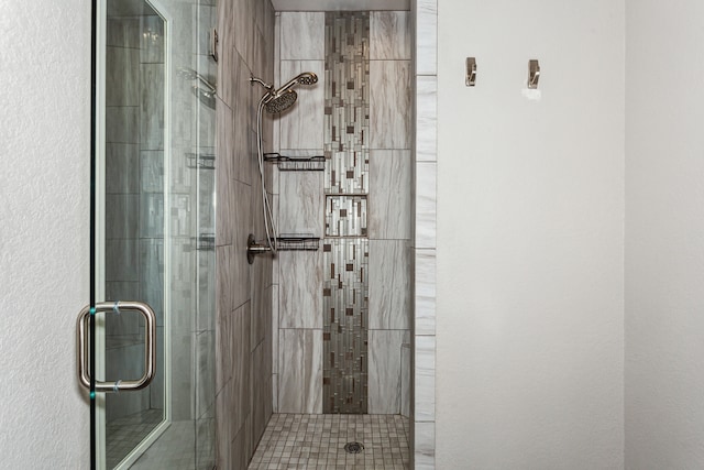 bathroom featuring an enclosed shower