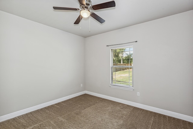 spare room featuring ceiling fan and carpet floors