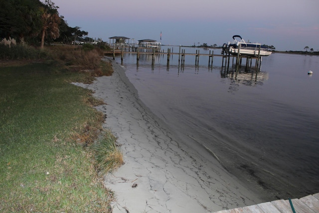 209 W Miracle Strip Pkwy Apt A104, Mary Esther, FL 32569 - dock area with a water view and boat lift
