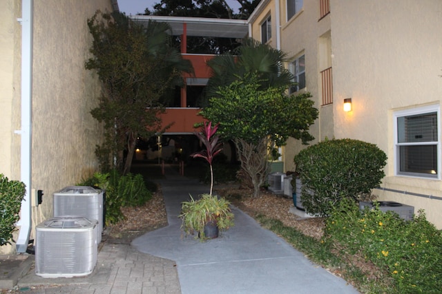 209 W Miracle Strip Pkwy Apt A104, Mary Esther, FL 32569 - view of building exterior with central AC unit