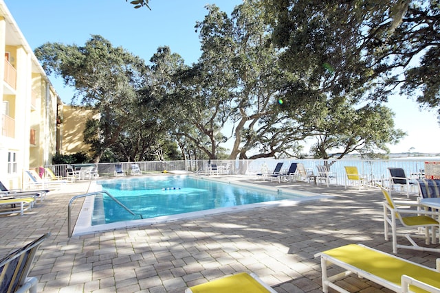 209 W Miracle Strip Pkwy Apt A104, Mary Esther, FL 32569 - community pool with fence and a patio area