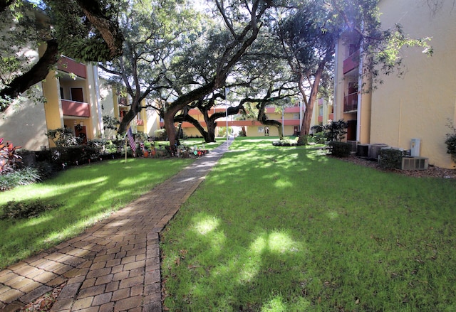 209 W Miracle Strip Pkwy Apt A104, Mary Esther, FL 32569 - view of home's community featuring a lawn