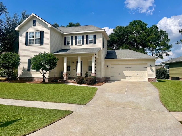 view of front facade featuring a front yard, covered porch, and a garage