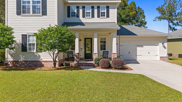 view of front of home with a porch, a front lawn, and a garage