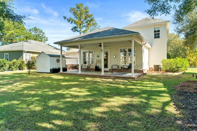 back of house with a patio, a yard, central air condition unit, and ceiling fan