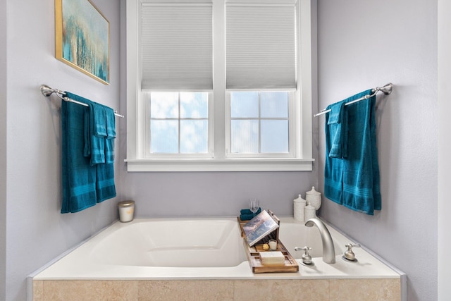 bathroom featuring tiled bath