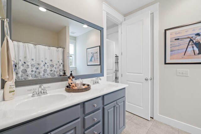 bathroom featuring vanity and tile patterned flooring