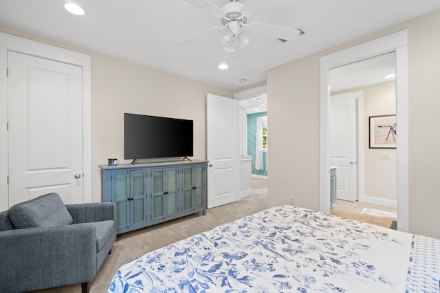 bedroom featuring light colored carpet and ceiling fan