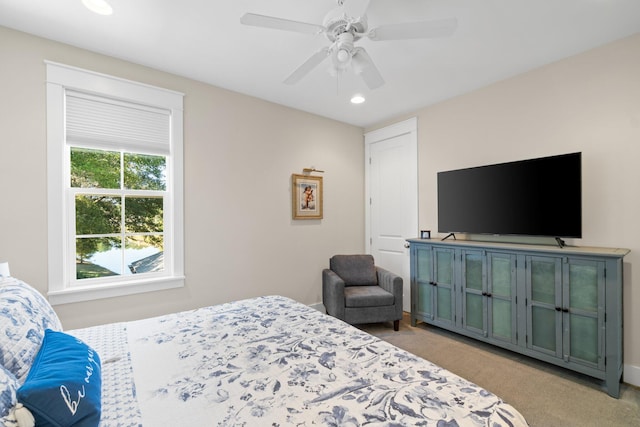 carpeted bedroom with ceiling fan