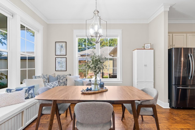 dining space with dark wood-type flooring, a notable chandelier, and ornamental molding