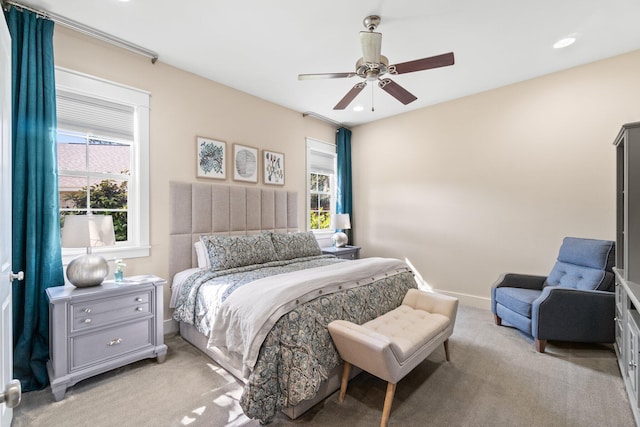 carpeted bedroom featuring ceiling fan