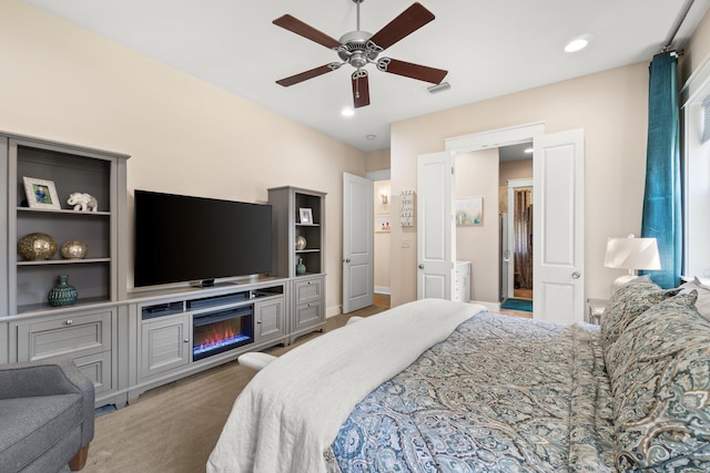 carpeted bedroom featuring ceiling fan