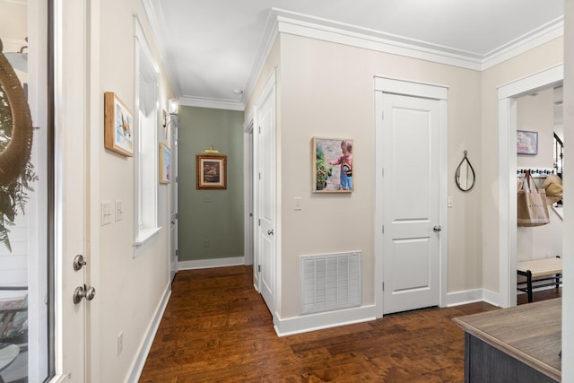 entryway with crown molding and dark hardwood / wood-style flooring