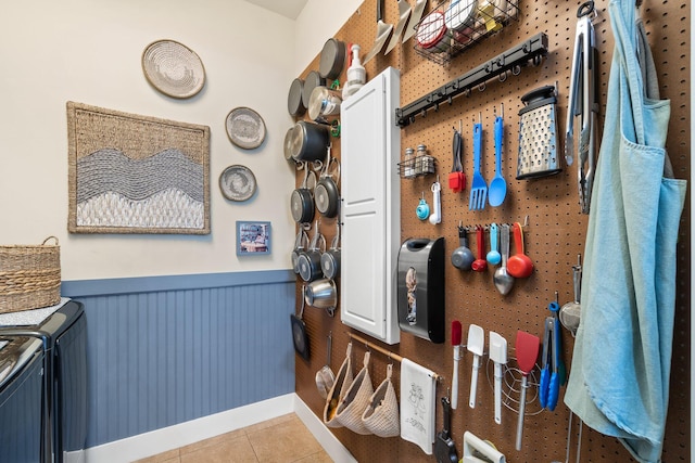 kitchen with separate washer and dryer and light tile patterned floors