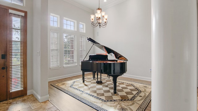 entryway with plenty of natural light and ornamental molding