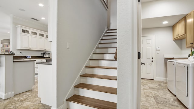 stairway with ornamental molding and washing machine and clothes dryer