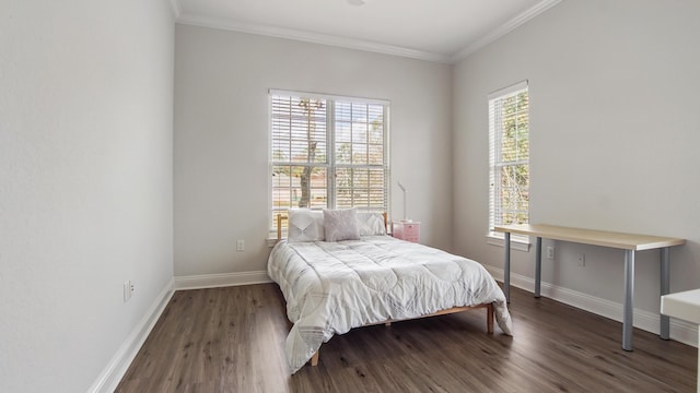 bedroom with crown molding and dark hardwood / wood-style flooring