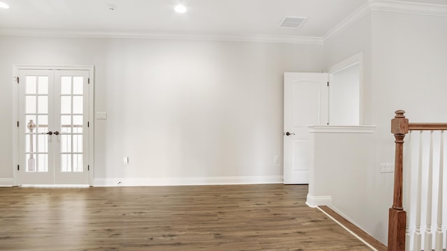 unfurnished room featuring crown molding, french doors, and dark hardwood / wood-style floors