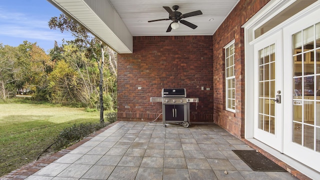 view of patio with french doors, area for grilling, and ceiling fan