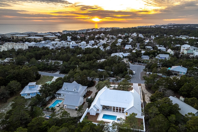 aerial view at dusk with a water view