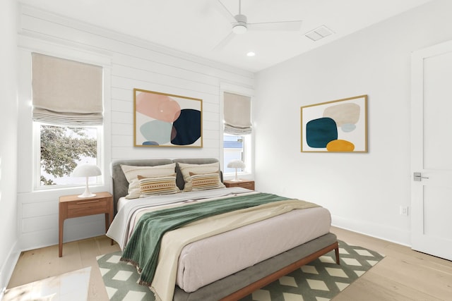 bedroom with baseboards, visible vents, ceiling fan, wood finished floors, and recessed lighting