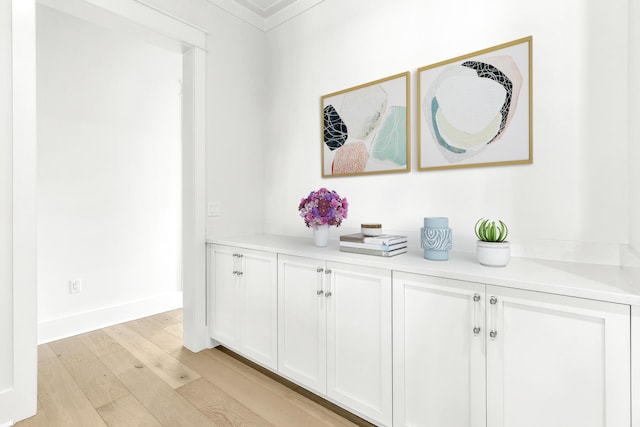 room details with baseboards and wood finished floors